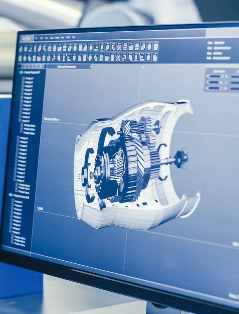 CAD software displaying engineering design on monitor.