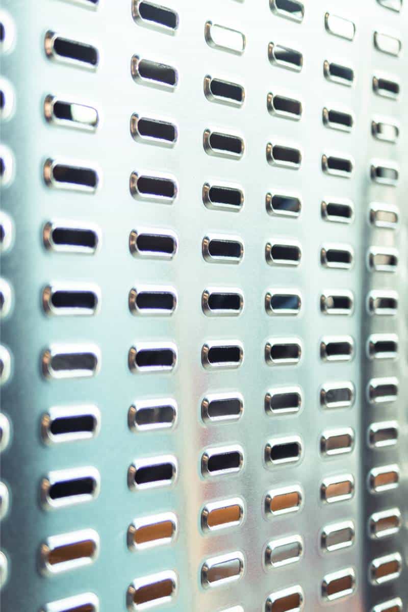 Close-up of a perforated metal surface.